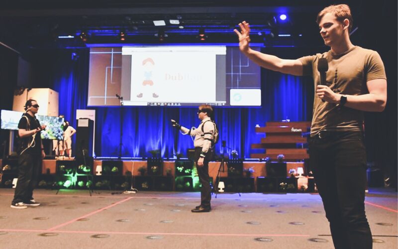 Two players on stage during a DubHap match at the Superhuman Sports Design Challenge