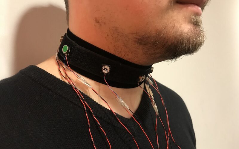 Collar with vibration motors worn around the neck