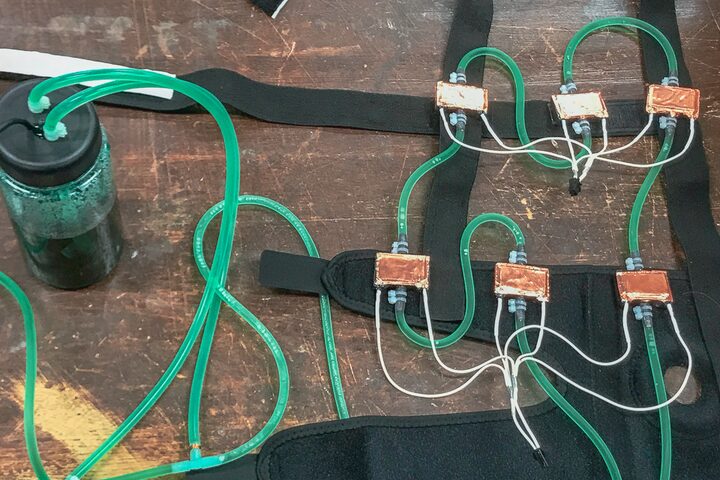 Water cooling loop with copper heat exchangers mounted on straps