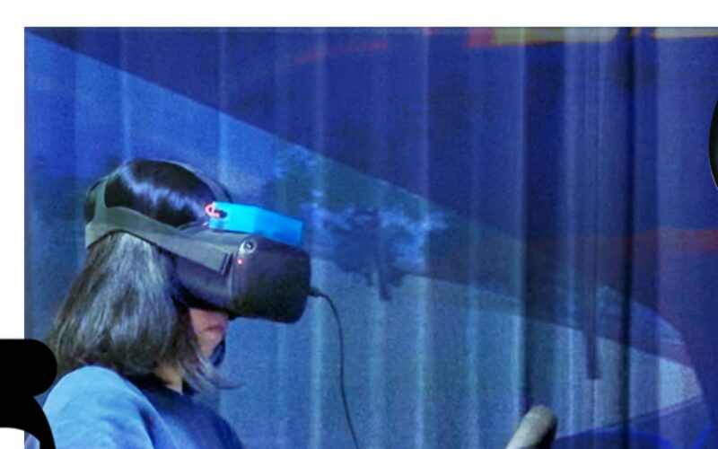 Participant wearing the thermal headset in a driving simulator